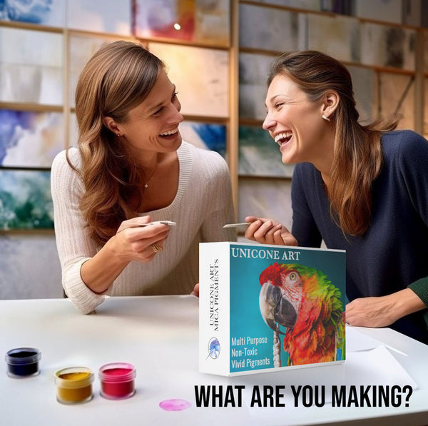 2 women talking together before making an art project with colorful mica pigments